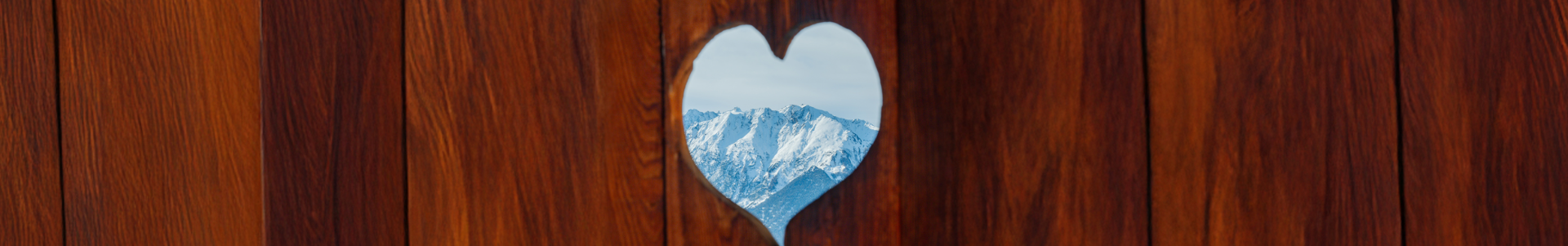Mountain view through a wooden heart